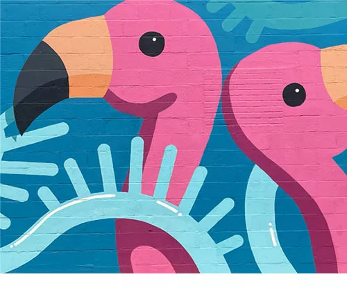 flamingo mural on brick wall