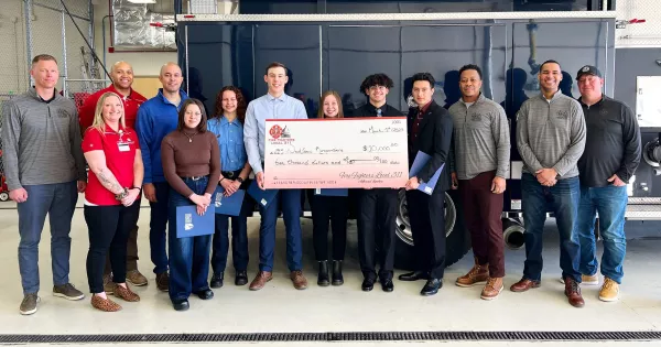 Local 311 fire fighters present students and staff with $10,000 check